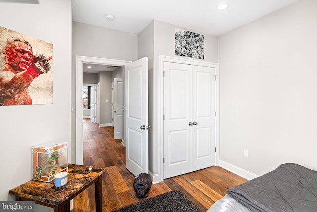 bedroom with hardwood / wood-style floors