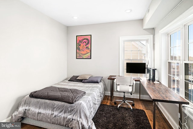 bedroom featuring dark hardwood / wood-style floors