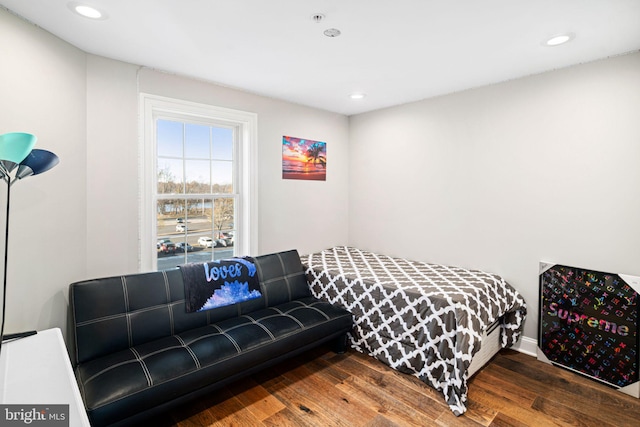 bedroom with hardwood / wood-style flooring