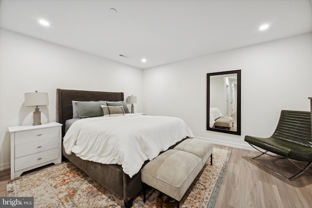 bedroom with light hardwood / wood-style floors