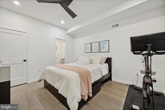 bedroom with light wood-type flooring and ceiling fan