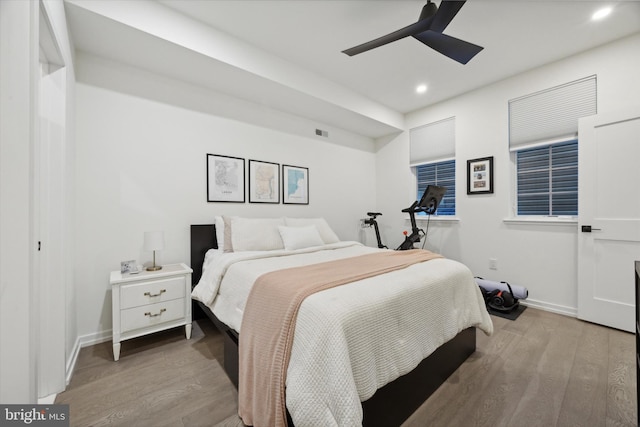 bedroom with light wood-type flooring and ceiling fan