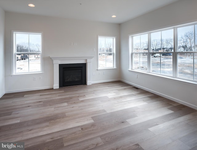 15 Tilghman Trl, Mechanicsburg, PA 17050 - unfurnished living room featuring a fireplace, baseboards, wood finished floors, and recessed lighting