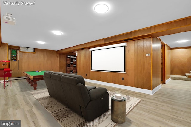 home theater featuring baseboard heating, wood walls, billiards, and light wood-type flooring