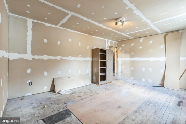 spare room with wood-type flooring