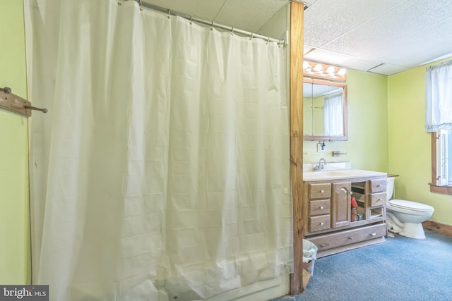 bathroom featuring vanity, toilet, and a healthy amount of sunlight