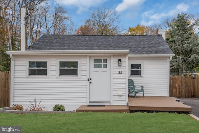 view of outdoor structure with a lawn