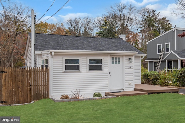 view of outdoor structure with a lawn