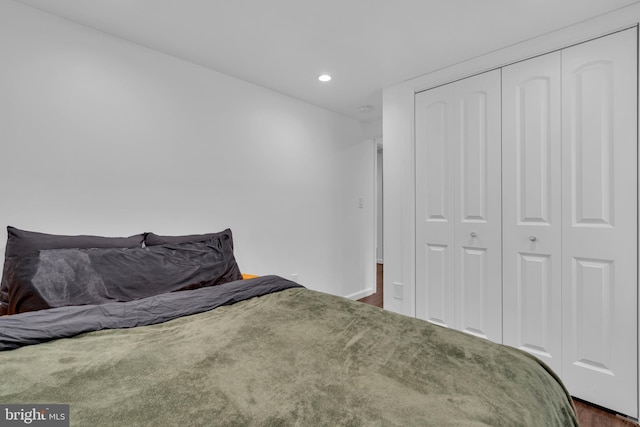 carpeted bedroom featuring a closet