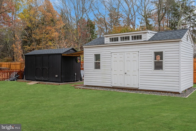 view of outbuilding with a yard