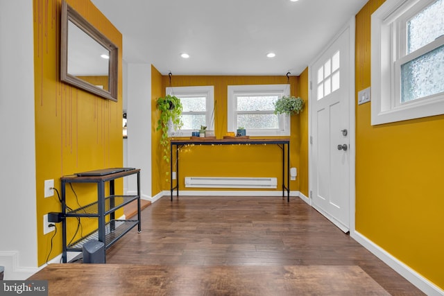 foyer featuring dark hardwood / wood-style floors and a baseboard heating unit