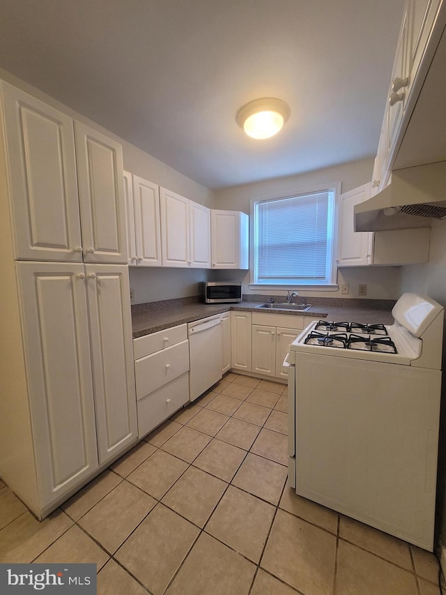 kitchen with sink, white cabinets, light tile patterned flooring, and white appliances