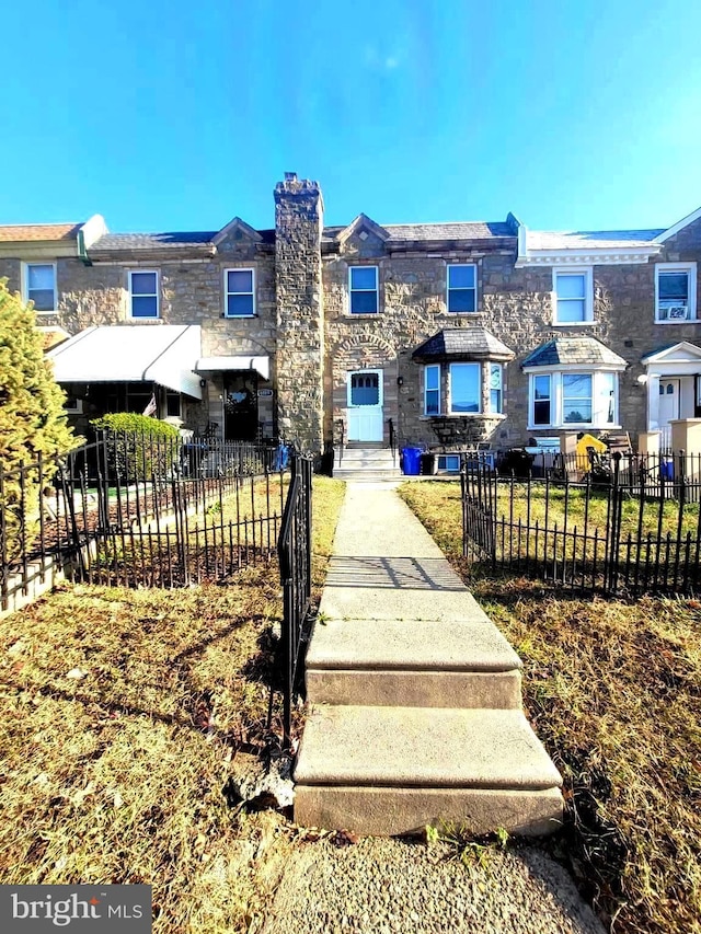 6107 Loretto Ave, Philadelphia, PA 19149 - view of property featuring a chimney and stone siding