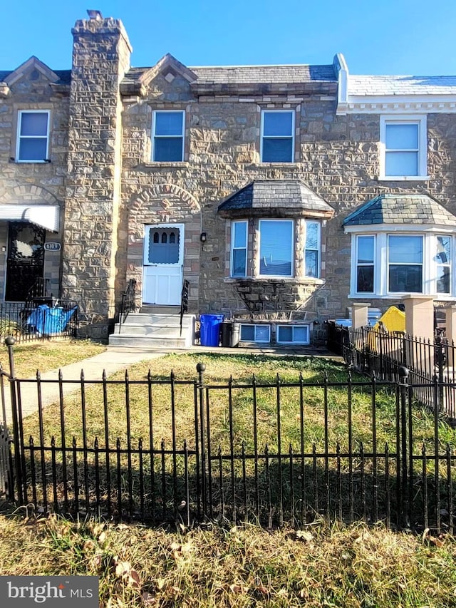 6107 Loretto Ave, Philadelphia, PA 19149 - view of front of property with stone siding and a chimney