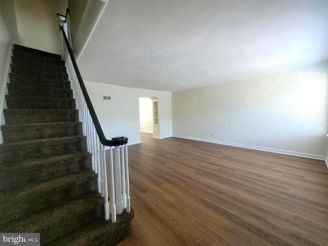 stairway featuring hardwood / wood-style flooring