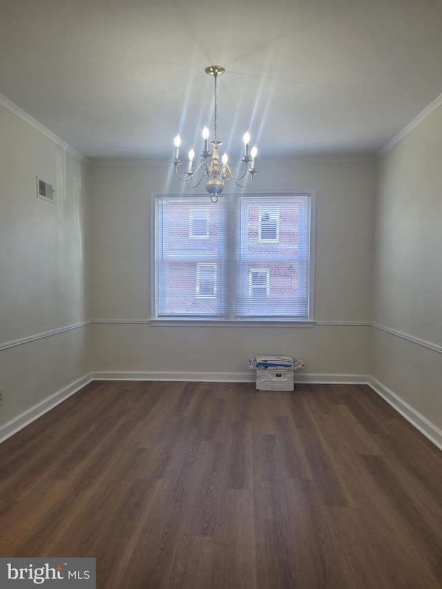 unfurnished dining area with crown molding, dark hardwood / wood-style floors, and a notable chandelier