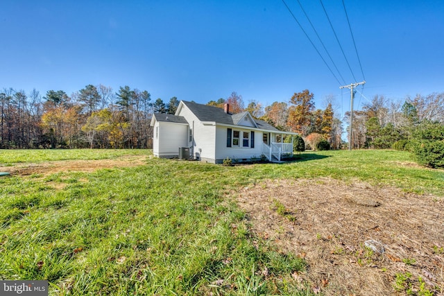 view of side of home featuring a lawn