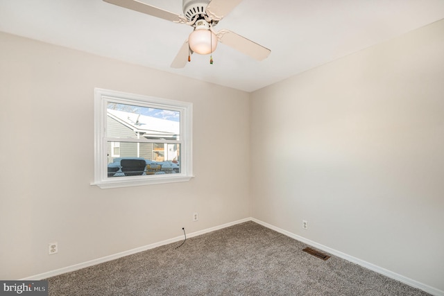 spare room with ceiling fan and carpet floors