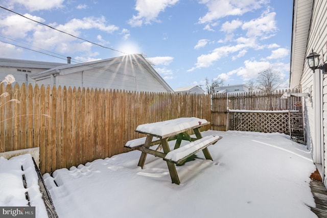 view of snow covered patio