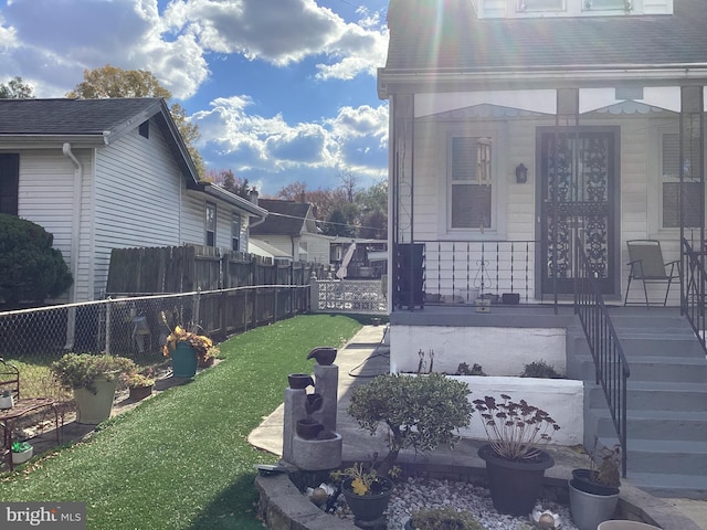 view of yard with covered porch