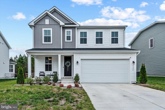 view of front of home with a garage and a front yard