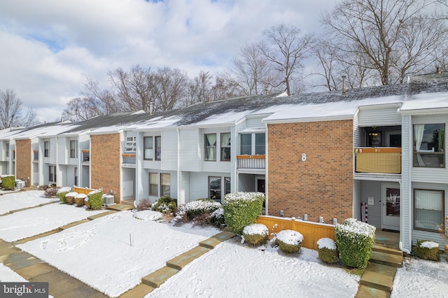 view of snow covered property