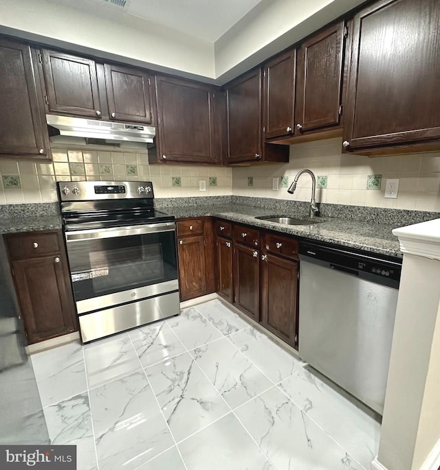 kitchen featuring decorative backsplash, sink, stainless steel appliances, and dark brown cabinets