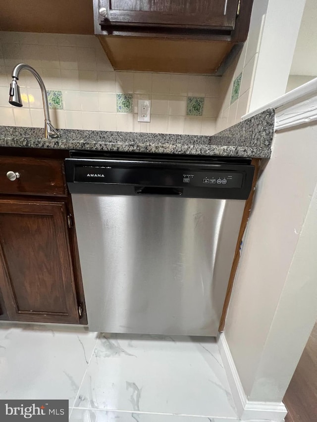 details with tasteful backsplash, dishwasher, dark stone counters, and dark brown cabinets