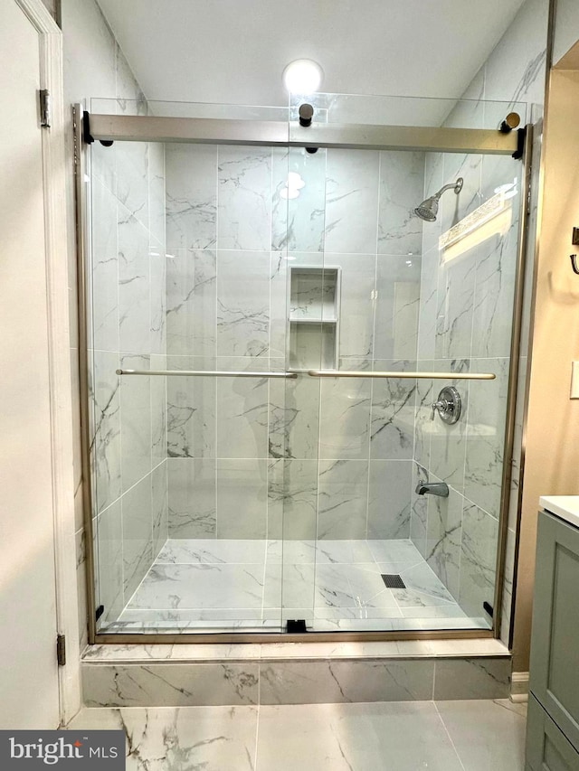 bathroom with vanity and walk in shower