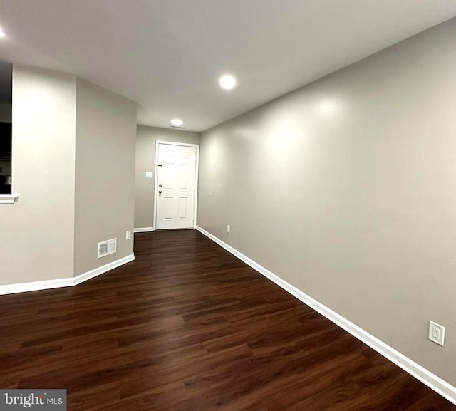 entryway with dark hardwood / wood-style flooring