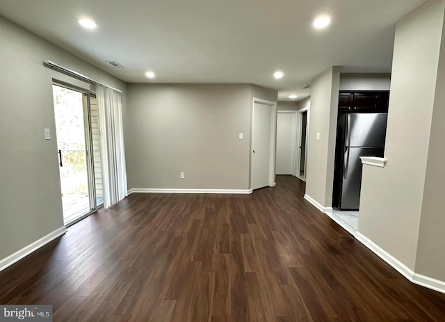 unfurnished living room featuring dark hardwood / wood-style flooring