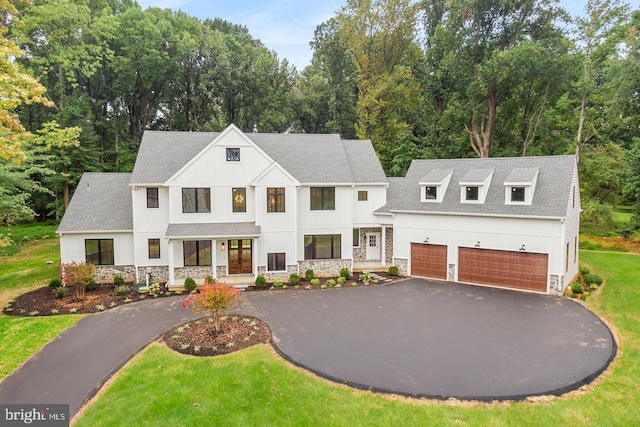 1739 Garnet Mine Rd Lot 2, Garnet Valley, PA 19060 - modern farmhouse featuring asphalt driveway, stone siding, a front lawn, roof with shingles, and a garage