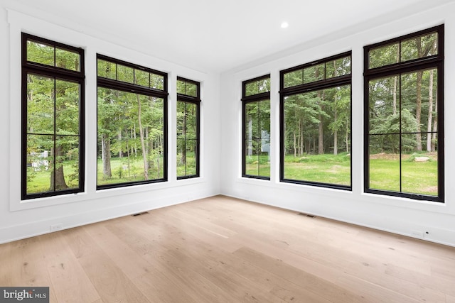 unfurnished sunroom featuring a healthy amount of sunlight