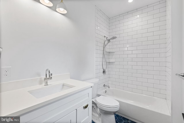 full bathroom featuring vanity, tiled shower / bath combo, and toilet