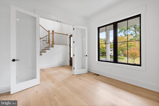 1739 Garnet Mine Rd Lot 2, Garnet Valley, PA 19060 - empty room with hardwood / wood-style floors, stairway, baseboards, and french doors