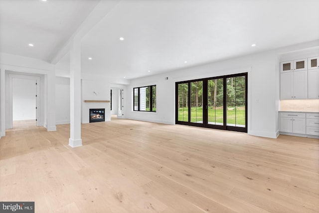 1739 Garnet Mine Rd Lot 2, Garnet Valley, PA 19060 - unfurnished living room with light wood finished floors, a glass covered fireplace, baseboards, and recessed lighting