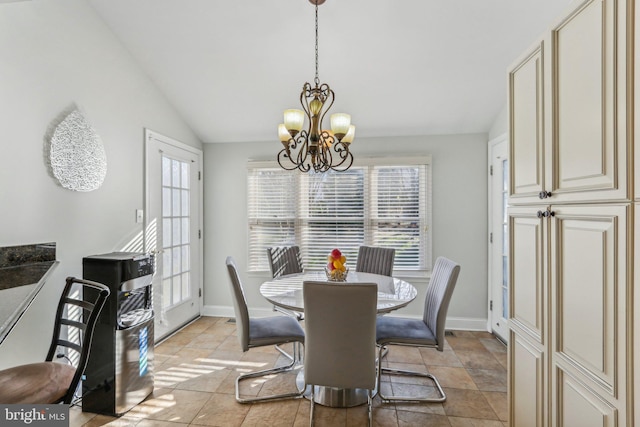 dining space with a notable chandelier and lofted ceiling