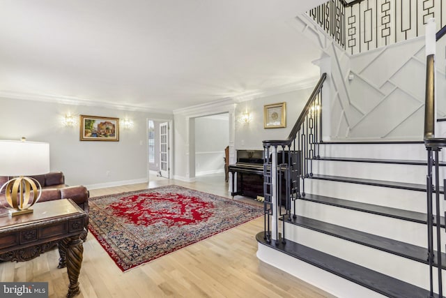 living room featuring hardwood / wood-style flooring and ornamental molding