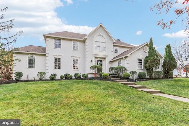 view of front of property with a front lawn