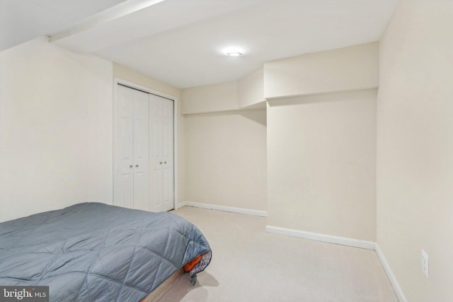 carpeted bedroom with a closet