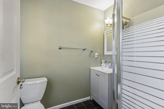 bathroom with tile patterned flooring, vanity, and toilet