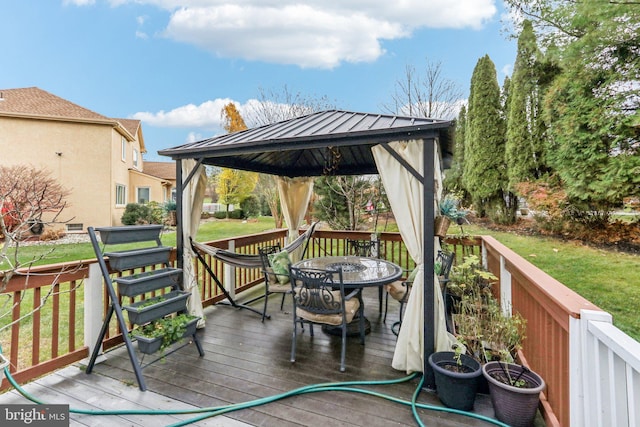 wooden deck with a gazebo and a yard