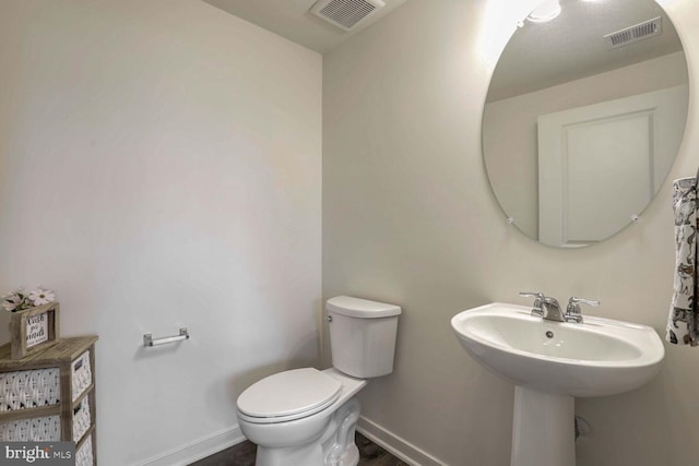 bathroom featuring sink and toilet