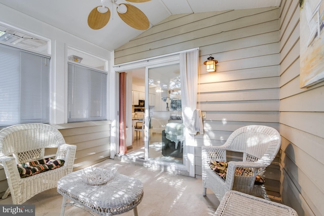 sunroom with ceiling fan and lofted ceiling