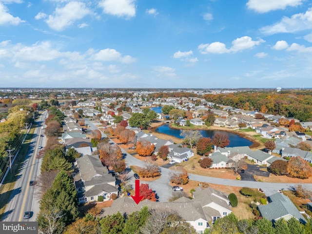 drone / aerial view with a water view