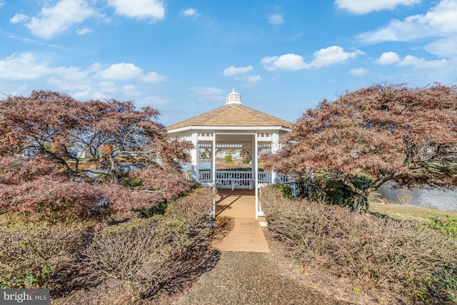 exterior space with a gazebo and a water view