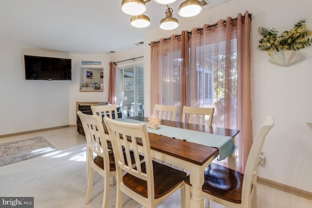 dining space with a notable chandelier