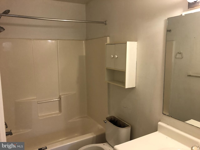 bathroom with shower / bathtub combination and toilet