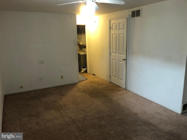 spare room with carpet floors and ceiling fan