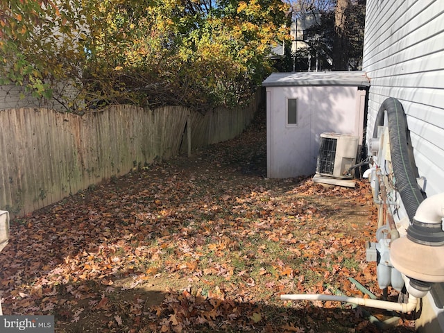 view of yard with central air condition unit